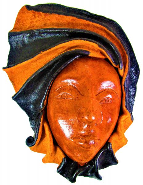 Art on dispaly at Tropical Art Fair - Sculpture of a brown face with black and red hair